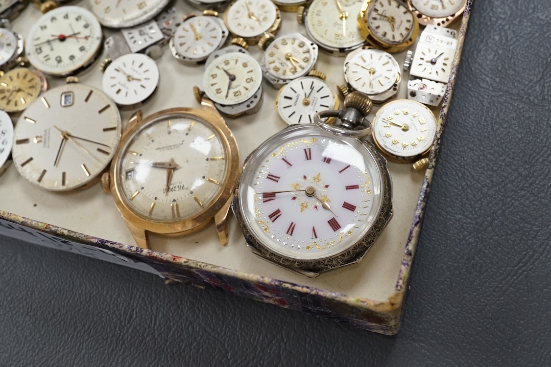 A quantity of assorted wrist and pocket watch movements, including Omega and Omega automatic, together with a pocket watch and a 935 white metal fob watch.